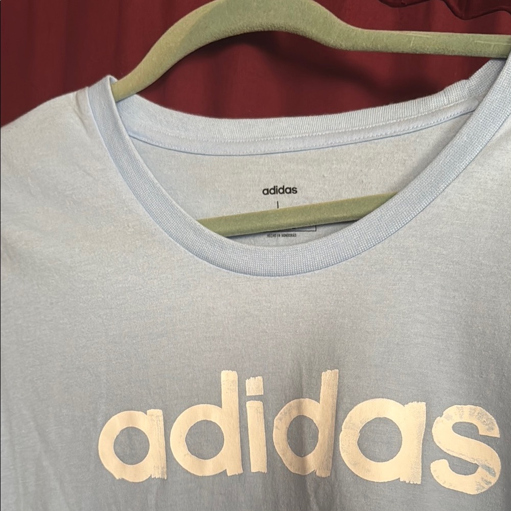 New Adidas Baby Blue T-Shirt with White Logo, size large.